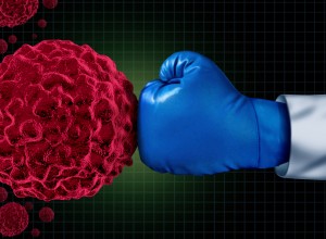 boxing glove punching a cancer virus