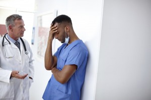 A doctor talks to a discouraged intern