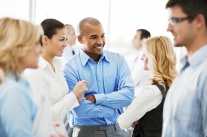 A group of people talking at an event