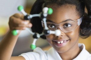 girl examines a molecule