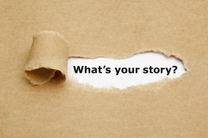 A piece of paper peeled back that reveals the phrase "What's Your Story?"