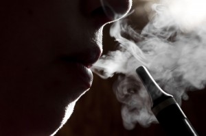 person smoking an e-cigarette