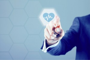 person pointing towards the camera with a heart sign heart monitor