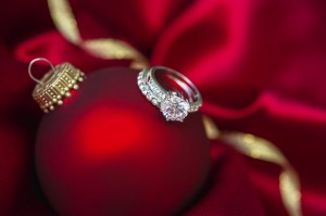 engagement rings on top of a holiday decorative bulb