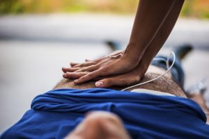 woman performing cpr