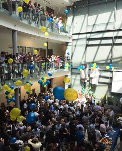 The buzzing crowd in the Anne and Mike Armstrong Medical Education Building atrium