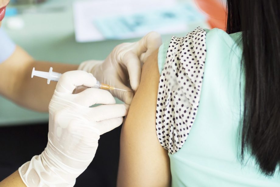 woman getting a vaccine injection