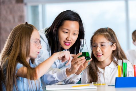 Science teacher with students