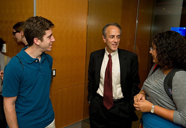 Roy Ziegelstein, vice dean for education, socializes with students at the first of a series of new seminars.