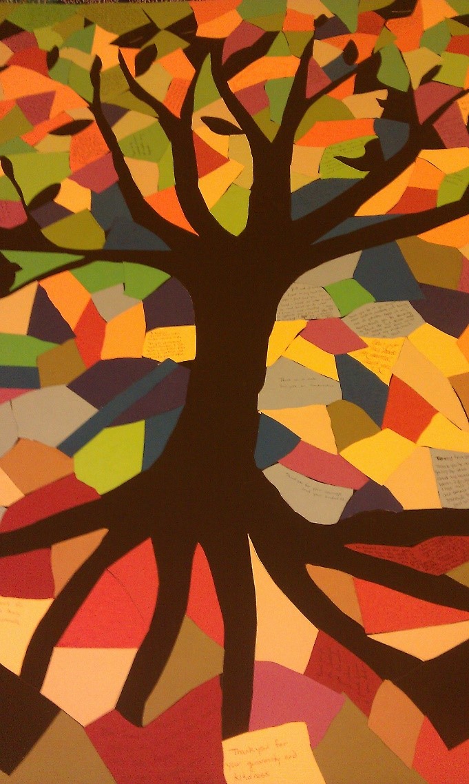 A mosaic of colorful papers, forming the image of a tree, made by Pranoti and her classmates.