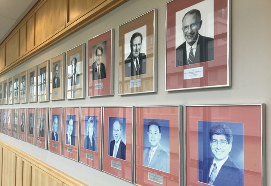 A wall of male portraits.