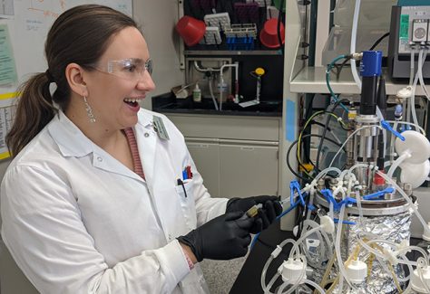 Natalie Majewska smiles while working in the lab.