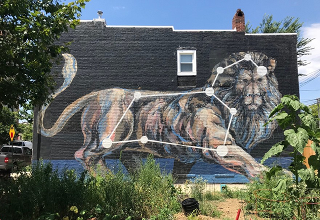 A mural of a lion outlined in a constellation of stars.