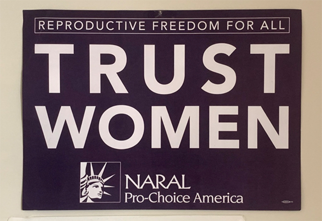 A sign that reads, "Reproductive Freedom for All: Trust Women."