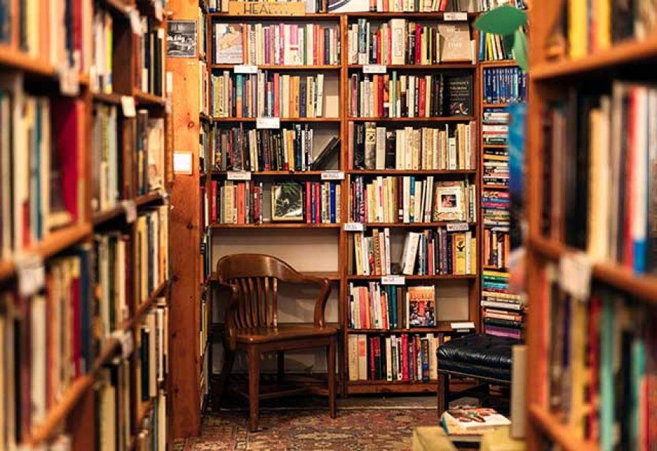 Interior of a bookstore with floor to ceiling bookshelves