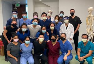 Medical students smile with their masks on