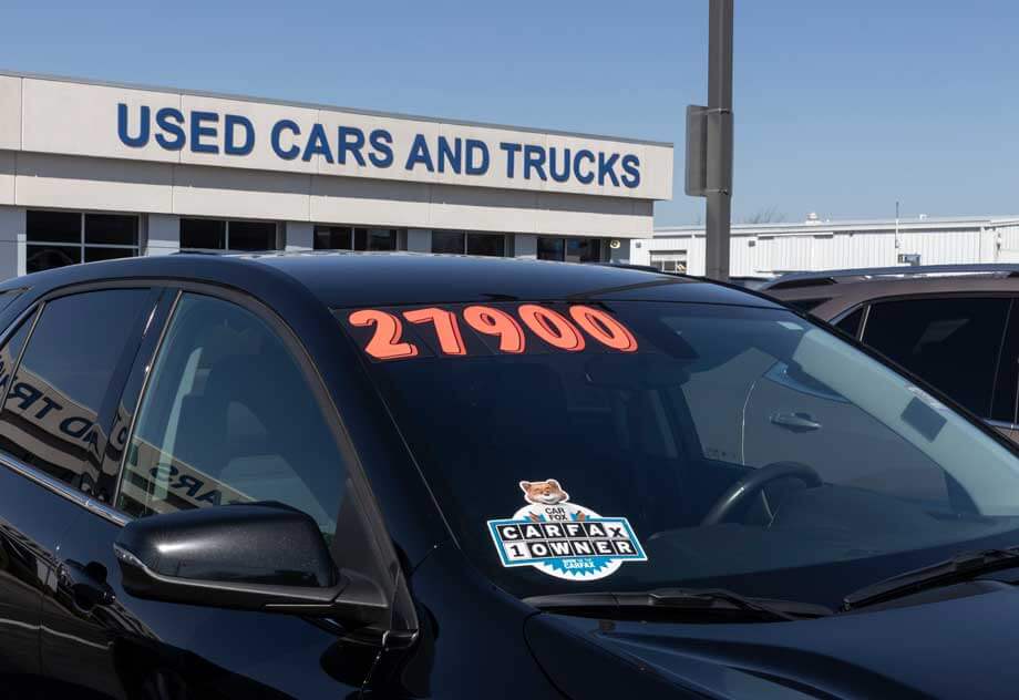 Carfax sticker on a used pre-owned vehicle. Carfax provides vehicle reports for prospective buyers that may reveal problems.