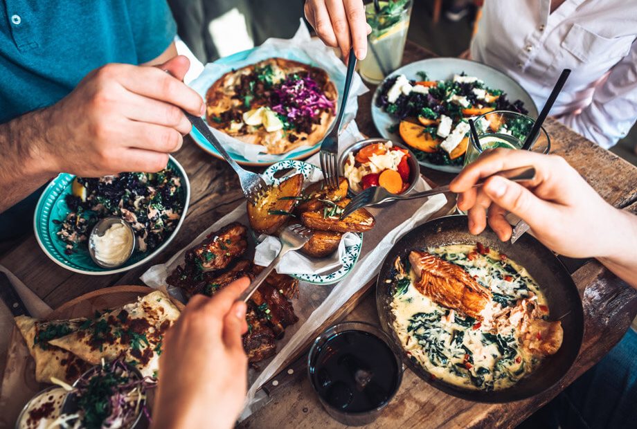 Happy people sharing their healthy lunch