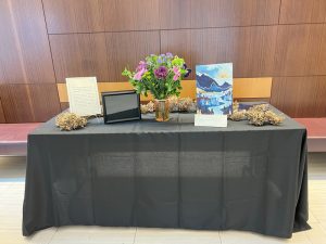 Anatomy Memorial table set up with black table cloth and flowers