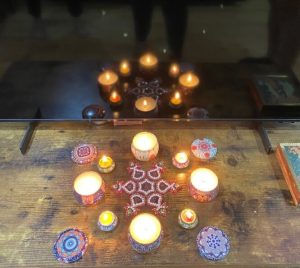 Lighting Diwali diyas.