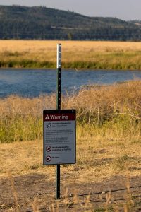 Sign for Brain eating amoeba in Kelly Warm Springs in Tetons