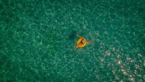 Photo of a woman relaxing in the sea, sitting on a inflatable ring