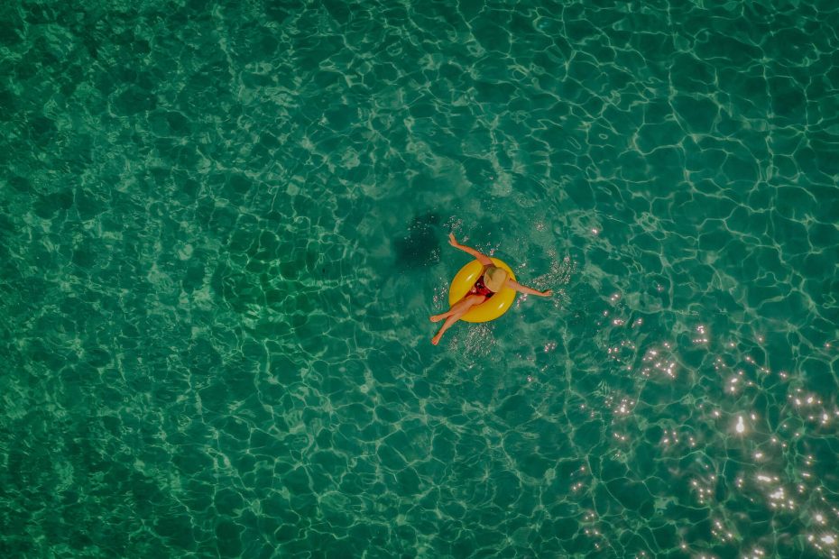 Photo of a woman relaxing in the sea, sitting on a inflatable ring