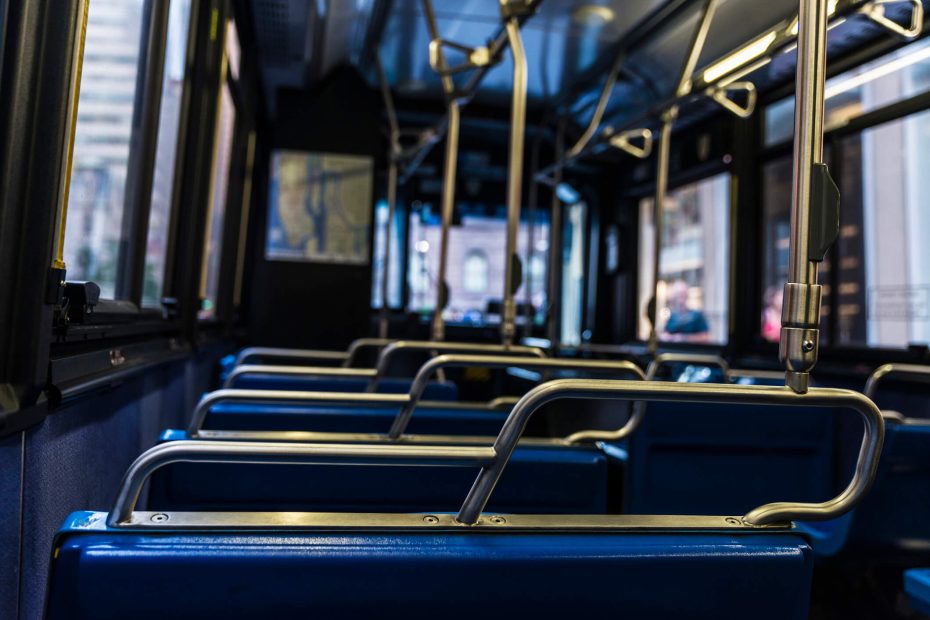 Empty blue seats with its metal handles inside a bus in Manhattan, New York City, USA