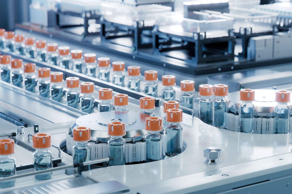 Vaccine Production Facility. Medication Manufacturing Process. Glass Vials with Orange Caps on Conveyor Belt. Medical Ampoule Production Line at Modern Pharmaceutical Factory.