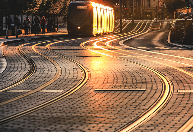City street scene with tramway at sunset in Bordeaux, France