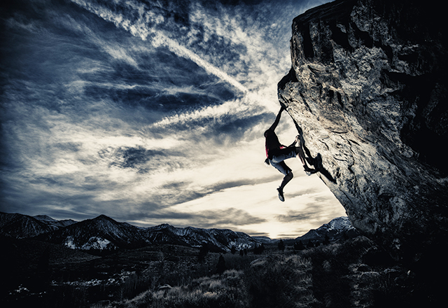 Rock climbing in a dramatic setting.