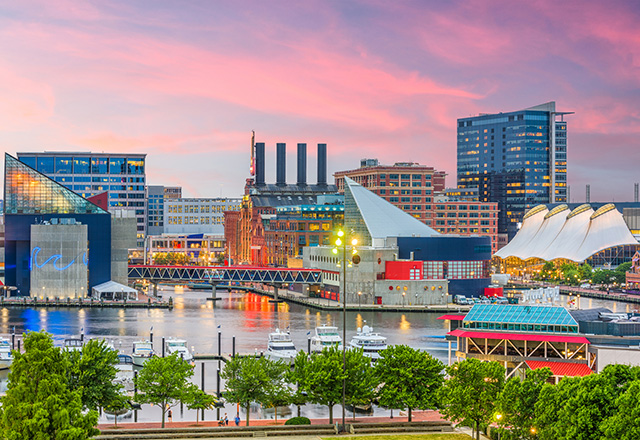 Baltimore, Maryland, USA Skyline over the Inner Harbor at dusk.