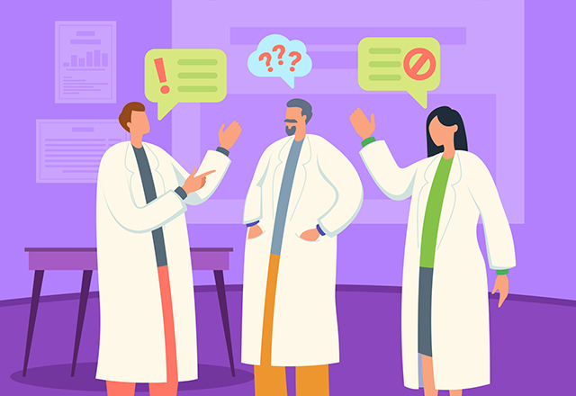 Scientists in white coats discussing new scientific discoveries in laboratory.